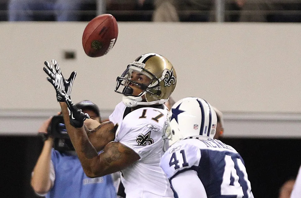 Nov 25, 2010; Arlington, TX, USA; New Orleans Saints receiver Robert Meachem (17) makes a catch on the final drive in the fourht quarter against Dallas Cowboys cornerback Terence Newman (41) at Cowboys Stadium. The Saints beat the Cowboys 30-27. Mandatory Credit: Matthew Emmons- USA TODAY Sports