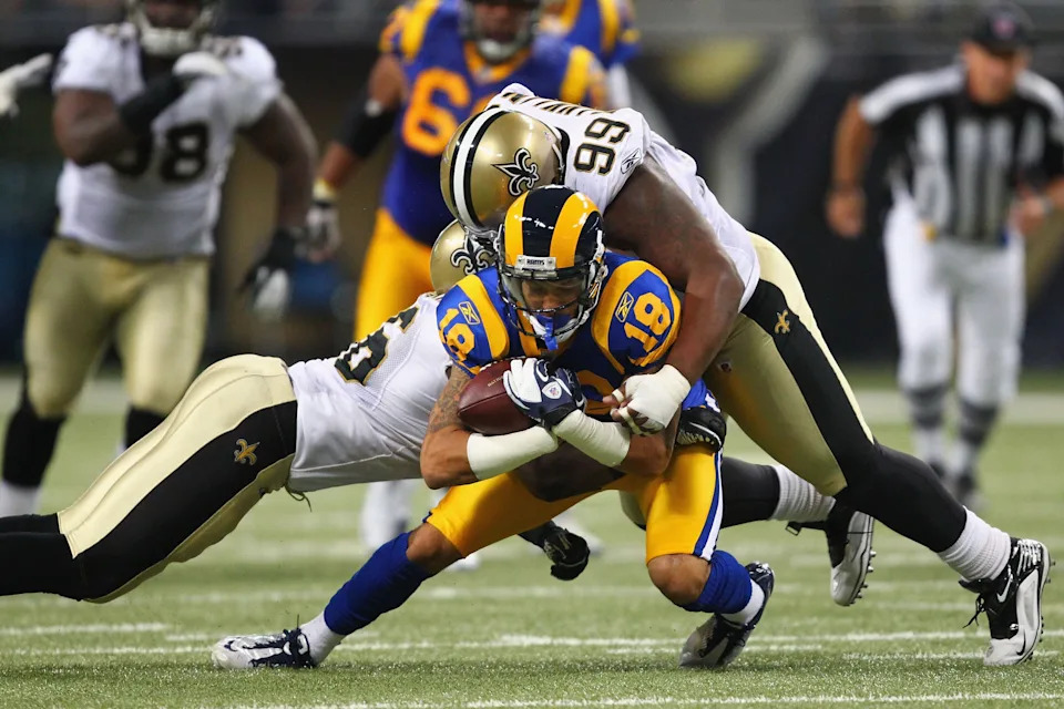 ST. LOUIS, MO - OCTOBER 30: Austin Pettis #18 of the St. Louis Rams is tackled by Aubrayo Franklin #99 of the New Orleans Saints at the Edward Jones Dome on October 30, 2011 in St. Louis, Missouri. The Rams beat the Saints 31-21. (Photo by Dilip Vishwanat/Getty Images)