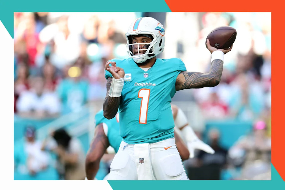 Miami Dolphins quarterback Tua Tagovailoa readies to throw a pass.