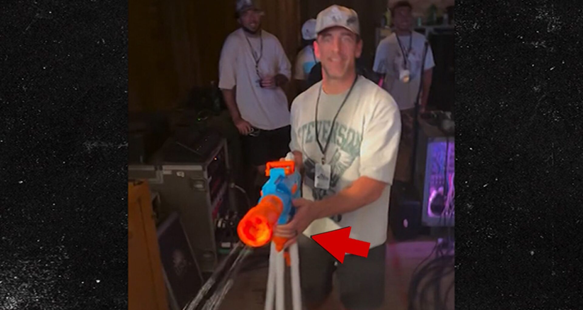 Aaron Rodgers Sports Ring On Wedding Finger, Shoots Water Gun At Mike. Concert