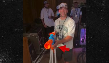 Aaron Rodgers Sports Ring On Wedding Finger, Shoots Water Gun At Mike. Concert