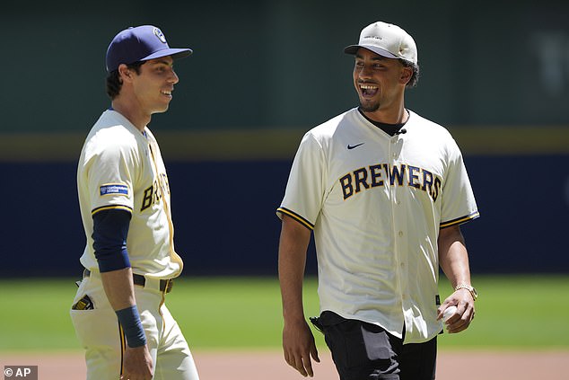 Unfortunately, his toss in to Christian Yelich (L) was too high and got mocked by the fans