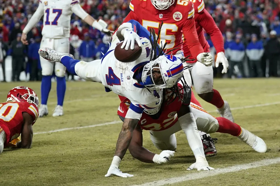 Buffalo Bills running back James Cook (4) dives for a touchdown against the Kansas City Chiefs during the second half in the AFC Championship game at GEHA Field at Arrowhead Stadium. Denny Medley-Imagn Images