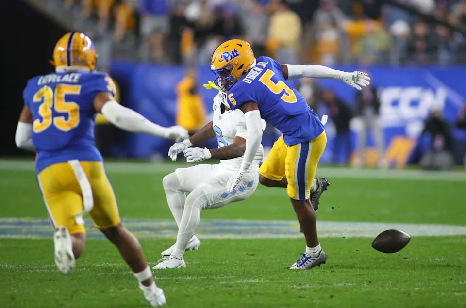 Pitt Panthers defensive back Phillip O'Brien Jr. (5) breaks up a pass intended for North Carolina Tar Heels Nate McCollum (6). © Michael Longo/For USA Today Network / USA TODAY NETWORK