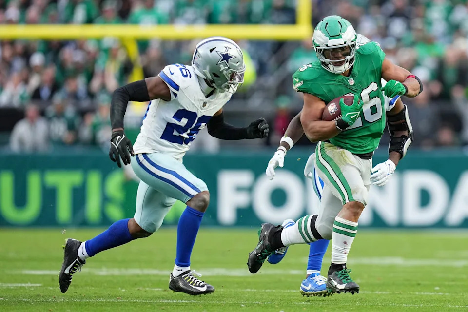 PHILADELPHIA, PENNSYLVANIA - DECEMBER 29: Saquon Barkley #26 of the Philadelphia Eagles runs the ball against DaRon Bland #26 of the Dallas Cowboys during the fourth quarter at Lincoln Financial Field on December 29, 2024 in Philadelphia, Pennsylvania. (Photo by Mitchell Leff/Getty Images)