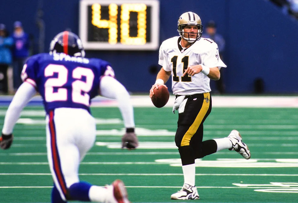 Oct 24, 1999; East Rutherford, NJ, USA; FILE PHOTO; New Orleans Saints quarterback Billy Joe Tolliver (11) in action against New York Giants defensive back Phillippi Sparks (22) at Giants Stadium. Mandatory Credit: Lou Capozzola-USA TODAY NETWORK
