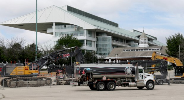 Construction equipments is lined up outside the former Arlington International...