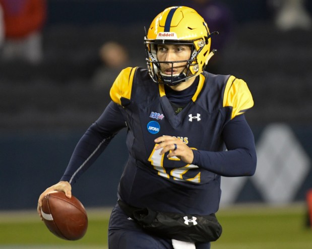 Texas A&M-Commerce quarterback Luis Perez (12) scrambles during the second half of the NCAA Division II college football championship game in Kansas City, Kan., Saturday, Dec. 16, 2017. (AP Photo/Reed Hoffmann)