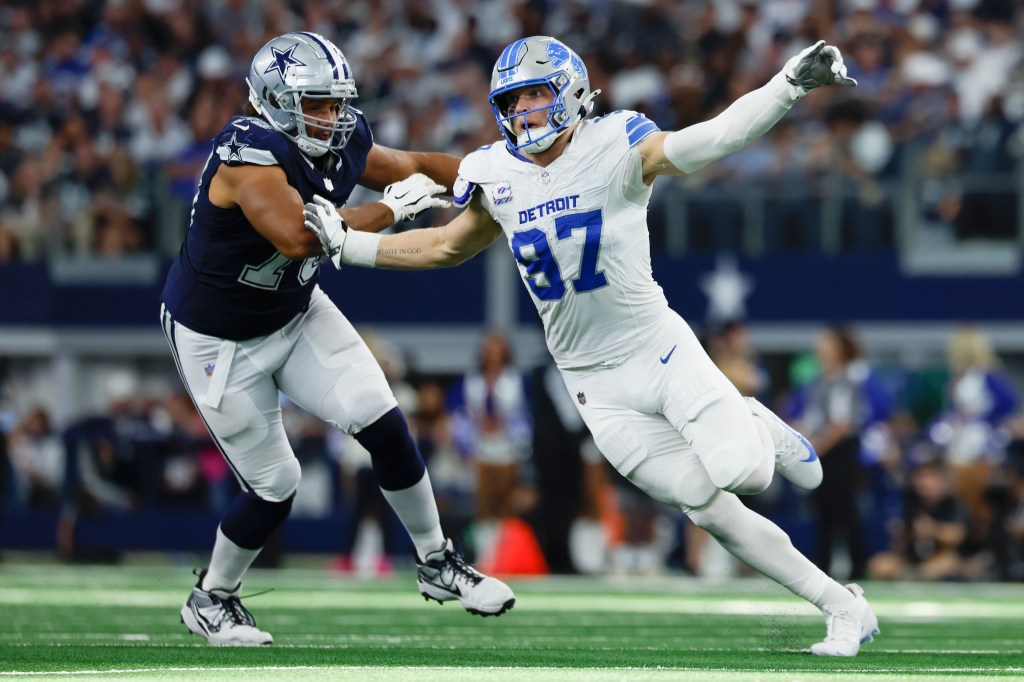 Detroit Lions defensive lineman Aidan Hutchinson (97) rushes against Terence Steele (78) during an NFL football game against the Dallas Cowboys on Sunday, Oct. 13, 2024, in Arlington, Texas. 