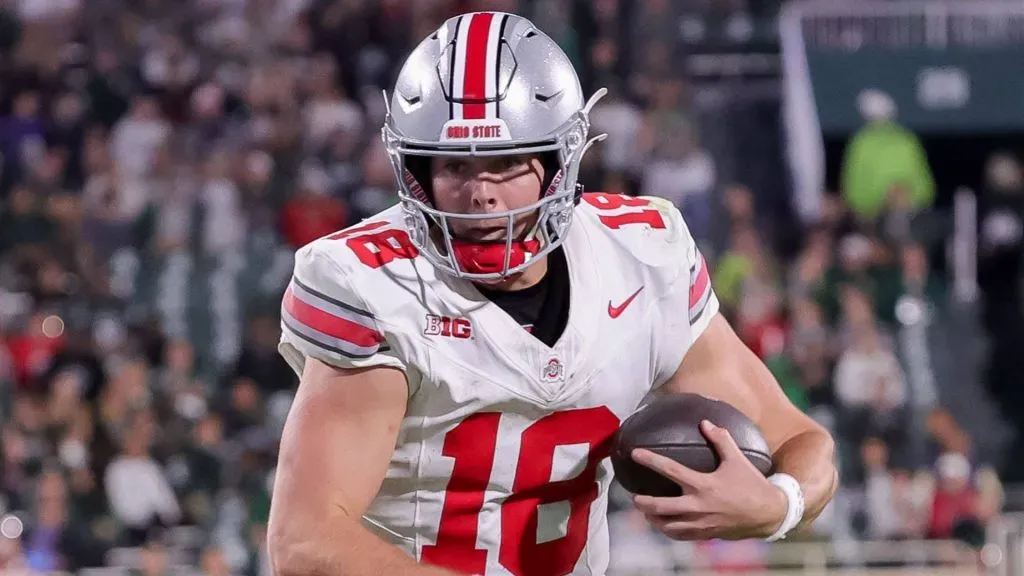 Will Howard carrying the football