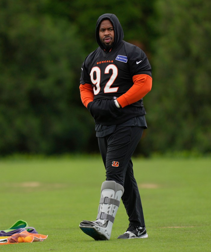 Cincinnati Bengals defensive tackle B.J. Hill (92) walks with a boot on his left leg during NFL football practice, Tuesday, May 6, 2025, in Cincinnati. (AP Photo/Carolyn Kaster)