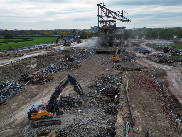 Crews demolish the grandstand and surrounding structures at the former...