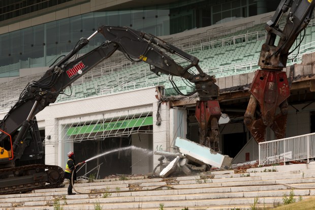 Demolition crews hired by the Chicago Bears begin knocking down...