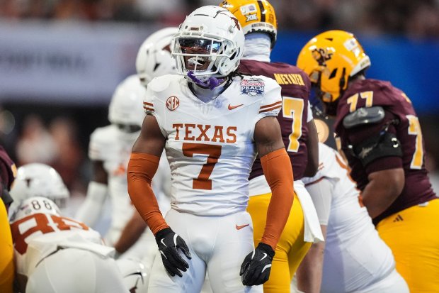 Texas cornerback Jahdae Barron (7) celebrates a play against Arizona State during a College Football Playoff quarterfinal Jan. 1, 2025, in Atlanta. (AP Photo/Brynn Anderson)