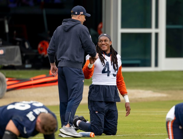 Bears coach Ben Johnson greets linebacker Tremaine Edmunds during practice Wednesday, May 28, 2025, at Halas Hall. (Brian Cassella/Chicago Tribune)