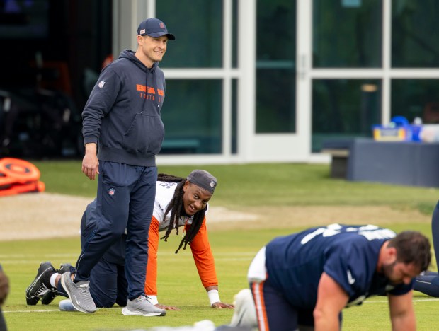 Bears coach Ben Johnson greets linebacker Tremaine Edmunds during practice Wednesday, May 28, 2025, at Halas Hall. (Brian Cassella/Chicago Tribune)