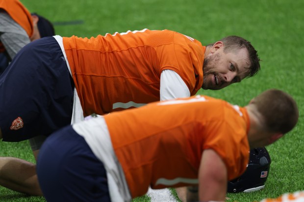 Case Keenum, top, works out during the Bears organized team activities in the Walter Payton Center at Halas Hall on May 21, 2025, in Lake Forest. (John J. Kim/Chicago Tribune)