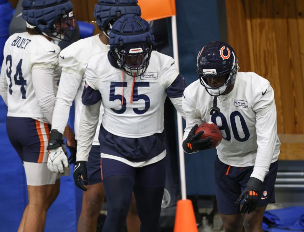 Dayo Odeyingbo (55) and Dominique Robinson (90) work out during the Bears organized team activities in the Walter Payton Center at Halas Hall on May 21, 2025, in Lake Forest. (John J. Kim/Chicago Tribune)