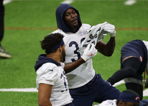 Tarvarius Moore, right, works out during the Bears organized team activities in the Walter Payton Center at Halas Hall on May 21, 2025, in Lake Forest. (John J. Kim/Chicago Tribune)