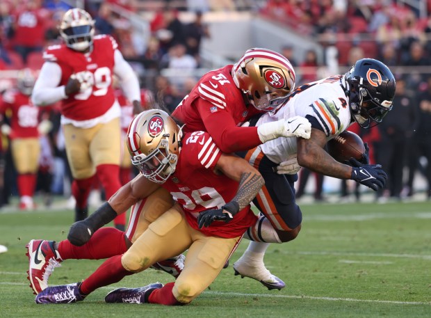 Bears running back D'Andre Swift is tackled by 49ers defensive end Robert Beal Jr. on Dec. 8, 2024, in Santa Clara, Calif. (John J. Kim/Chicago Tribune)
