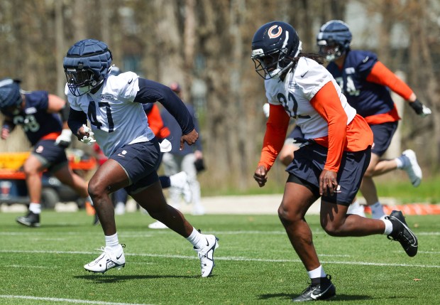 Rookie linebacker Ruben Hyppolite II (47), left, and Nana Asare Osafo-Mensah (92) warm up during Chicago Bears rookie camp at Halas Hall on May 9, 2025, in Lake Forest. (Stacey Wescott/Chicago Tribune)