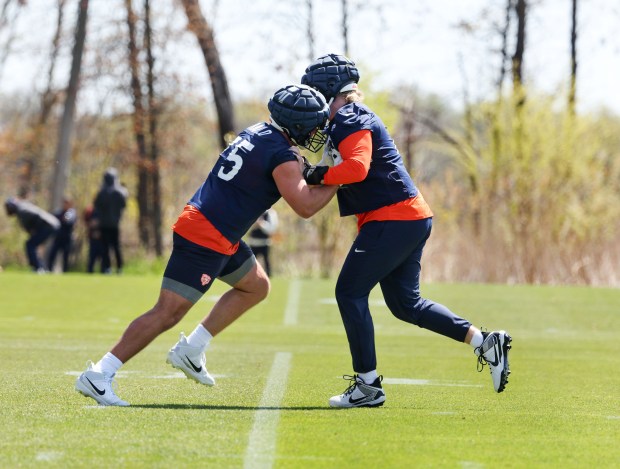 Rookie offensive lineman Ozzy Trapilo (75), left, faces off with Theo Benedet (79), right, during Chicago Bears rookie camp at Halas Hall on May 9, 2025, in Lake Forest. (Stacey Wescott/Chicago Tribune)