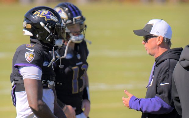 Ravens quarterback Lamar Jackson listens to offensive coordinator Todd Monken during practice Oct 17, 2024, in Owings Mills, Md. (Karl Merton Ferron/The Baltimore Sun)