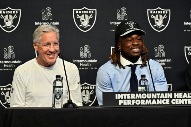 Raiders coach Pete Carroll, left, and first-round draft pick Ashton Jeanty attend a news conference April 25, 2025, in Henderson, Nev. (AP Photo/David Becker)