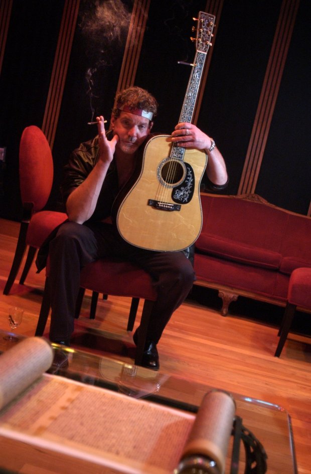 A July 15, 2002 portrait of Indianapolis Colts owner Jim Irsay with Elvis Presley's guitar. (Stephanie Sinclair/Chicago Tribune)