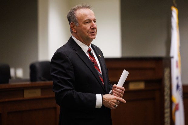 Arlington Heights mayor Jim Tinaglia speaks with attendees after being sworn in during a Village Board meeting on May 5, 2025, in Arlington Heights. (Armando L. Sanchez/Chicago Tribune)