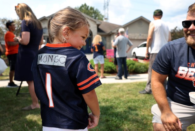 Malia Mrozek, 4, wears a a Bears jersey adorned with...
