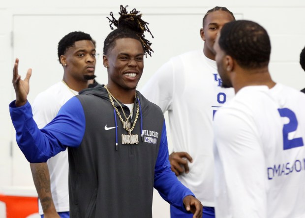Kentucky's Maxwell Hairston, left, congratulates teammate Jamon Dumas-Johnson after Dumas-Johnson's performance in the vertical jump during the school's NFL pro day on March 11, 2025. (AP Photo/James Crisp)
