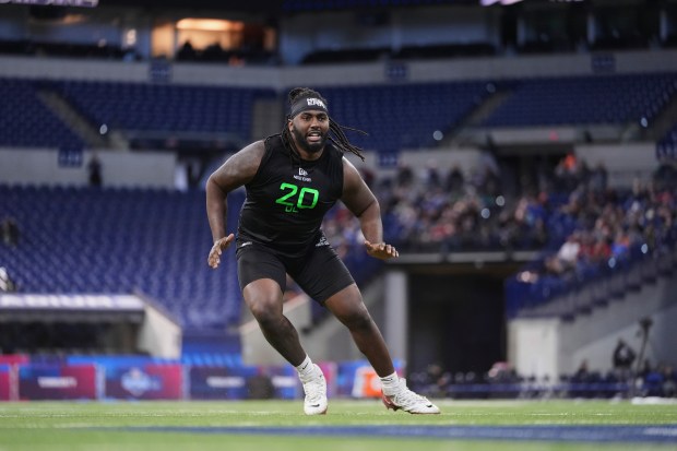 Ohio State offensive lineman Donovan Jackson runs a drill at the NFL combine on March 2, 2025. (AP Photo/Michael Conroy)
