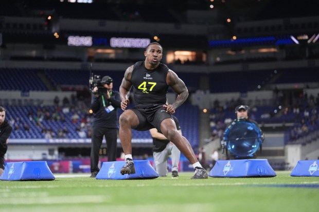 Boston College defensive lineman Donovan Ezeiruaku runs a drill at the NFL combine on Feb. 27, 2025. (AP Photo/Michael Conroy)