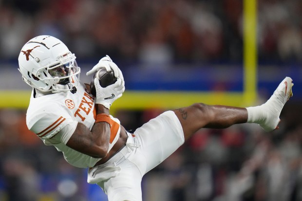 Texas wide receiver Matthew Golden catches a pass against Ohio State during the Cotton Bowl on Jan. 10, 2025, in Arlington, Texas. (AP Photo/Julio Cortez)