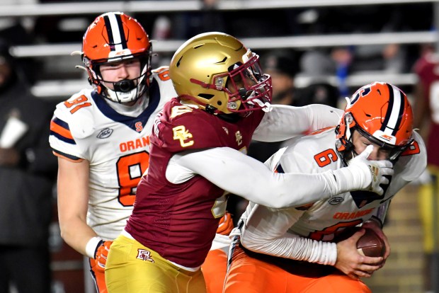 Boston College's Donovan Ezeiruaku sacks Sayracuse quarterback Garrett Shrader during the first half on Nov. 26, 2022, in Boston. (Mark Stockwell/AP photo) 