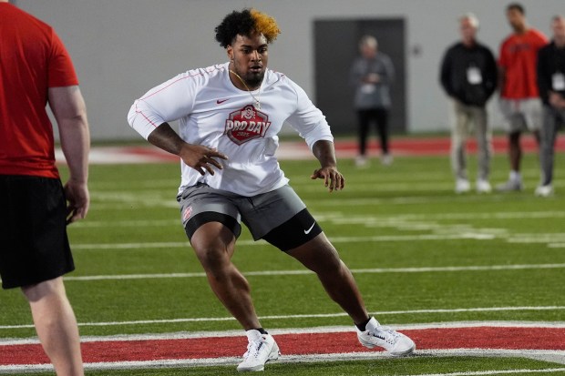 Ohio State offensive lineman Josh Simmons participates in a drill during the school's pro day on March 26, 2025, in Columbus, Ohio. (AP Photo/Sue Ogrocki)