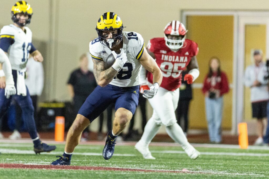 Michigan Wolverines tight end Colston Loveland runs with the ball against Indiana Hoosiers in college football game action at Memorial Stadium