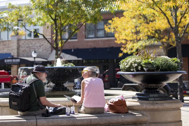 People in a park at the corner of Vail and...