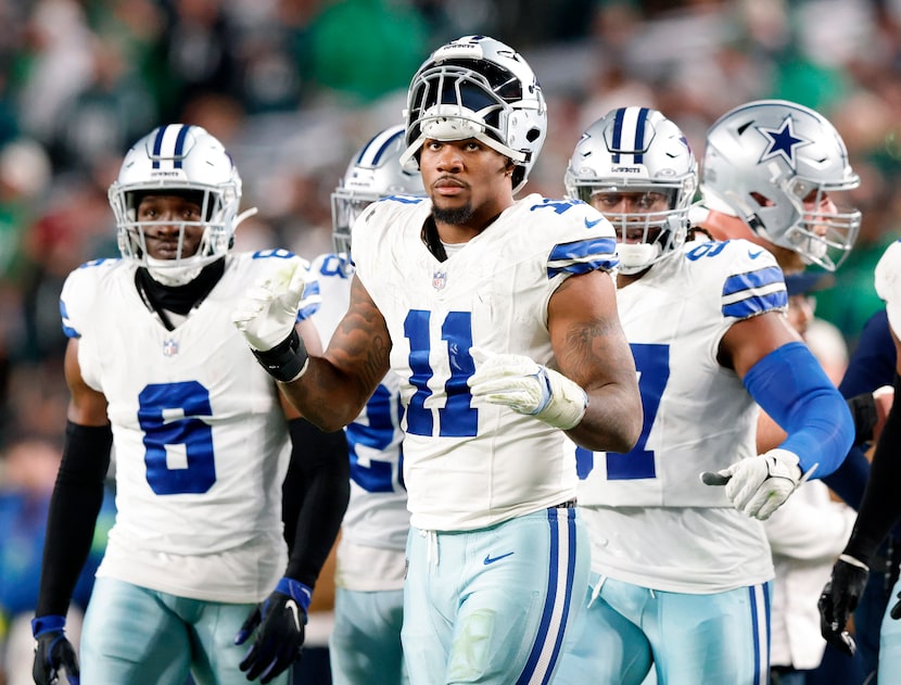 Dallas Cowboys linebacker Micah Parsons (11) heads back on the field after the offense came...