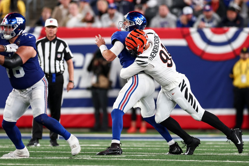 EAST RUTHERFORD, NEW JERSEY - OCTOBER 13: Trey Hendrickson #91 of the Cincinnati Bengals sacks Daniel Jones #8 of the New York Giants during the second half at MetLife Stadium on October 13, 2024 in East Rutherford, New Jersey. (Photo by Kevin Sabitus/Getty Images)