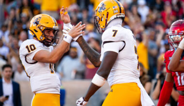 ASU QB Sam Leavitt celebrates with TE Chamon Metayer (Arizona State)...