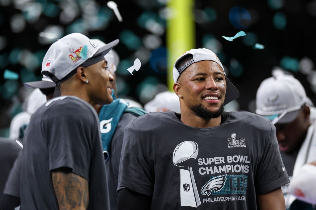 Saquon Barkley of the Philadelphia Eagles celebrating victory against Kansas City Chiefs at Super Bowl LIX in Louisiana, 2025.