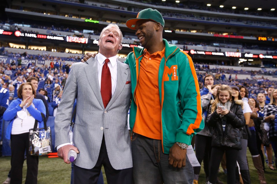 INDIANAPOLIS, IN - NOVEMBER 29: Indianapolis Colts owner Jim Irsay (L) talks with former player Reggie Wayne before the game against the Tampa Bay Buccaneers at Lucas Oil Stadium on November 29, 2015 in Indianapolis, Indiana. (Photo by Joe Robbins/Getty Images)