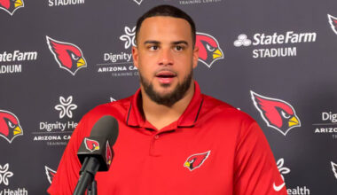 Arizona Cardinals guard Isaiah Adams speaks with reporters...