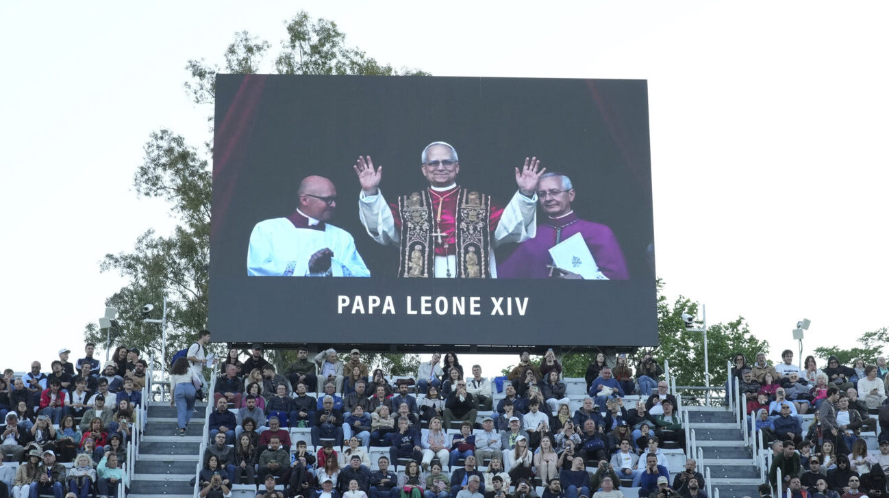 A screen flashes the news of new Pope Leo XIV, during the second round match between Italys' Fabio ...