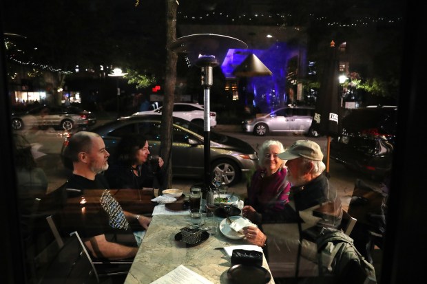 The Flynn family dines outside at Hey Nonny restaurant and...