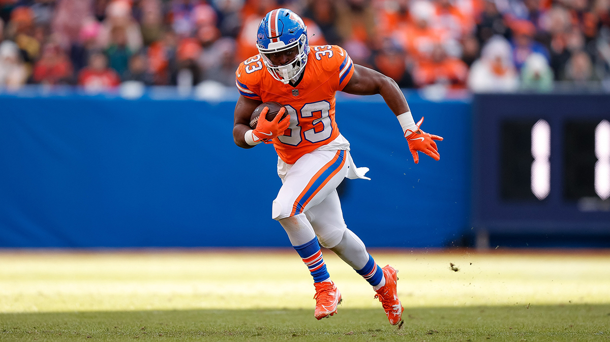 Denver Broncos running back Javonte Williams (33) runs the ball in the second quarter against the Kansas City Chiefs at Empower Field at Mile High.