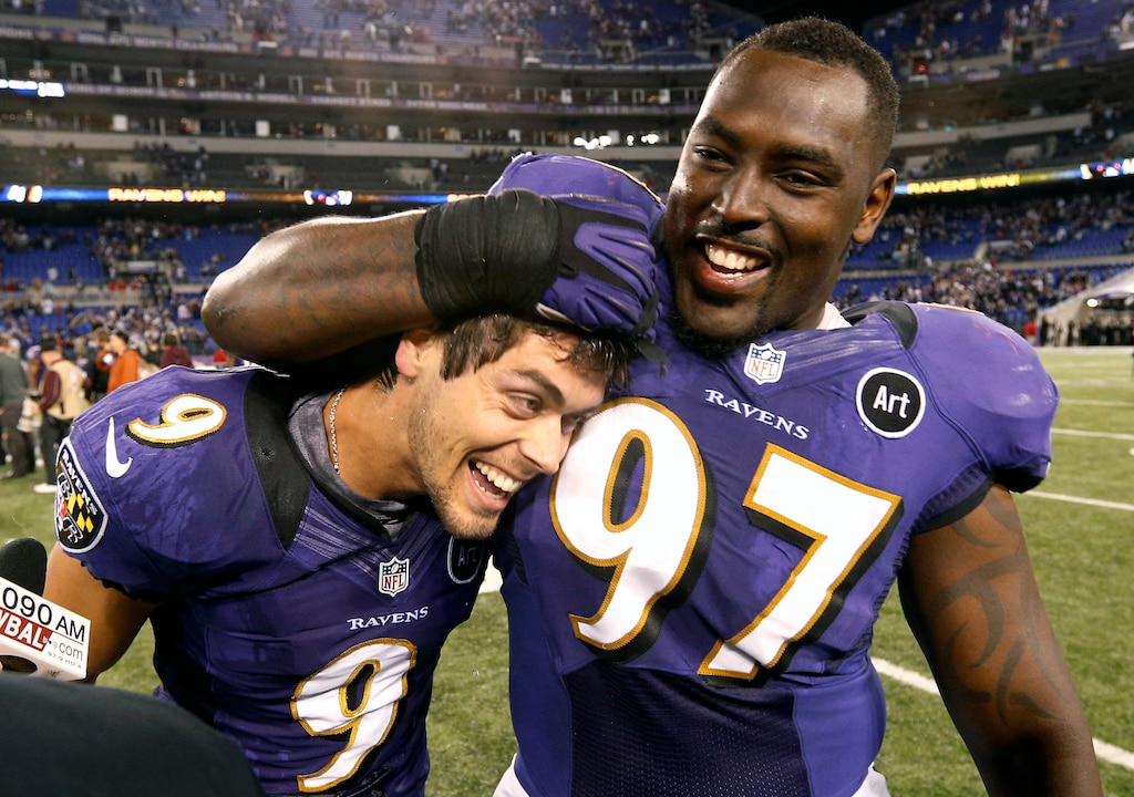 Baltimore Ravens kicker Justin Tucker, left, celebrates his game-winning field goal with teammate Arthur Jones after an NFL football game against the New England Patriots in Baltimore, Sunday, Sept. 23, 2012. Baltimore won 31-30.