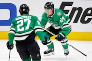 Dallas Stars center Mikael Granlund (64) leapt to his feet after scoring a third period hat...